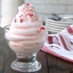 close up of peppermint whipped cream in bowl on table