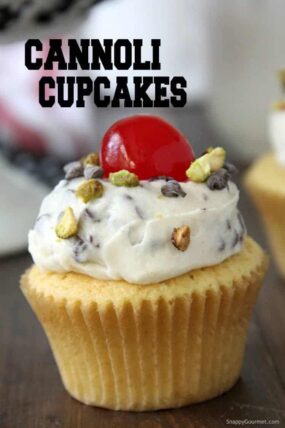 cannoli cupcake with cannoli frosting, pistachios, and maraschino cherry