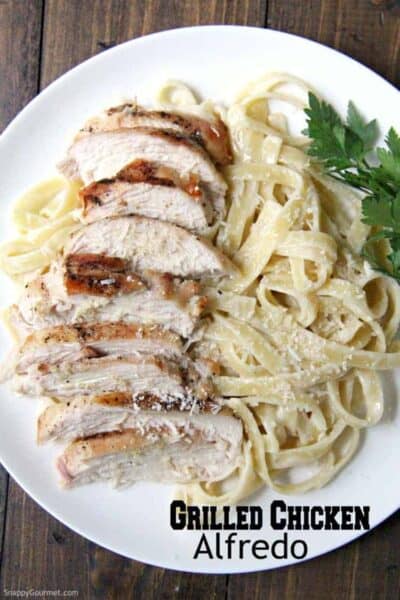 homemade Grilled Chicken Alfredo Pasta with parsley on plate