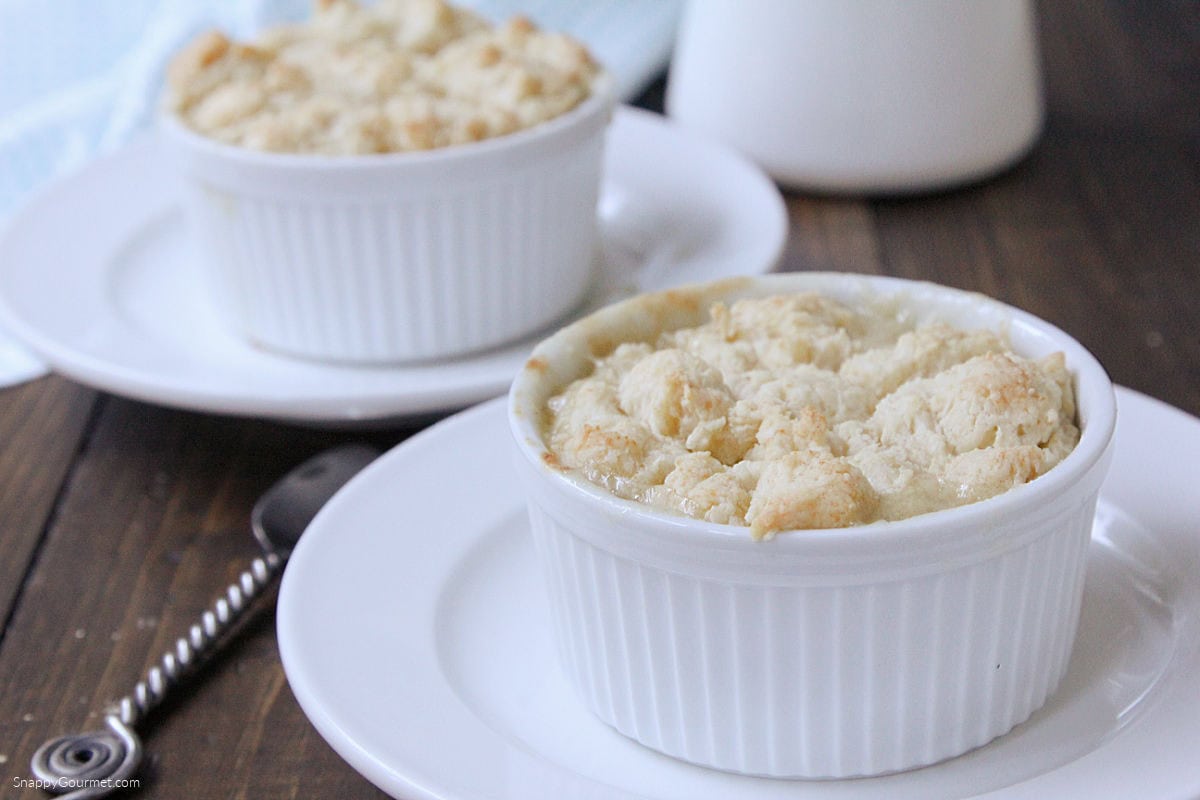 two Individual Chicken Pot Pies on ramekins on plates
