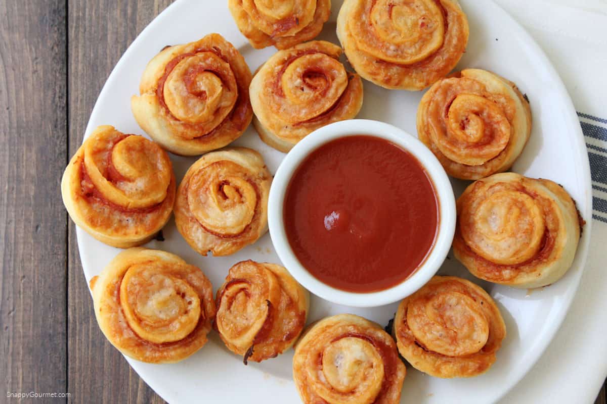 plate of pizza pinwheels and bowl of marinara sauce