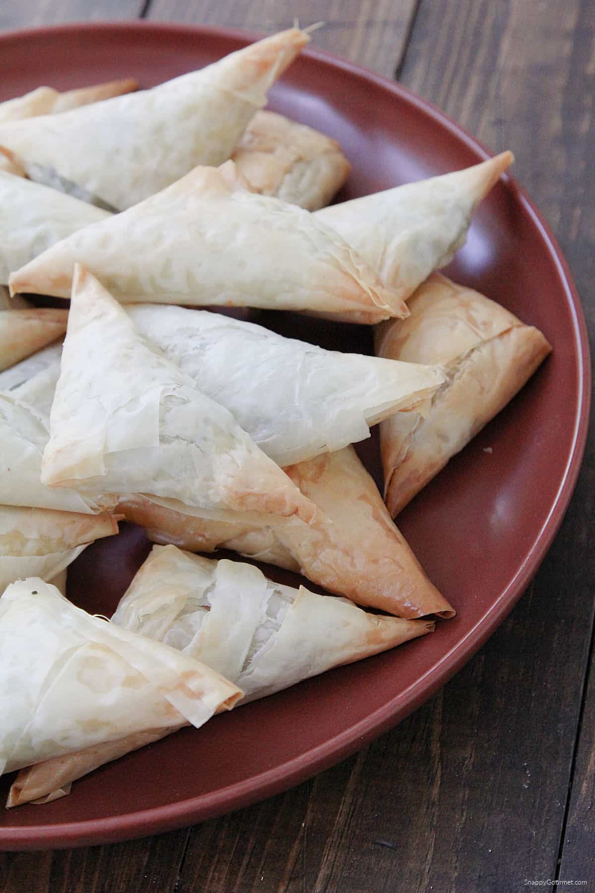Spinach & Feta Phyllo Turnovers stacked on plate