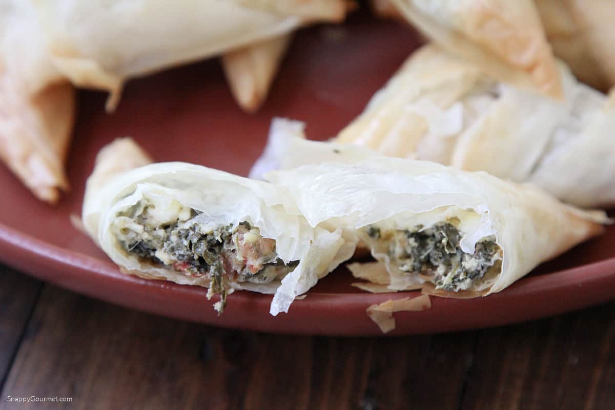 Spinach & Feta Phyllo Turnover cut open on plate