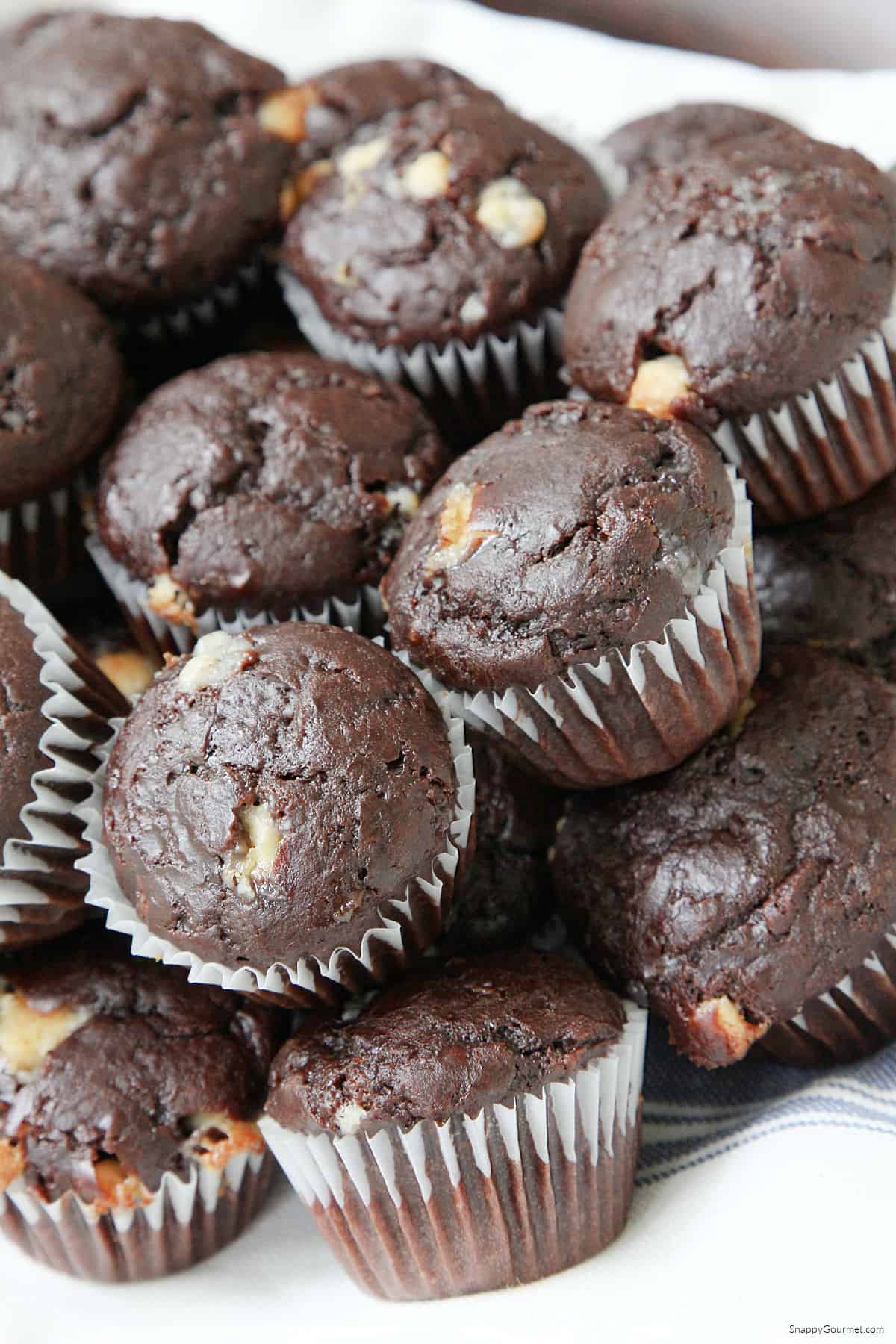 stack of mini chocolate chocolate chip muffins