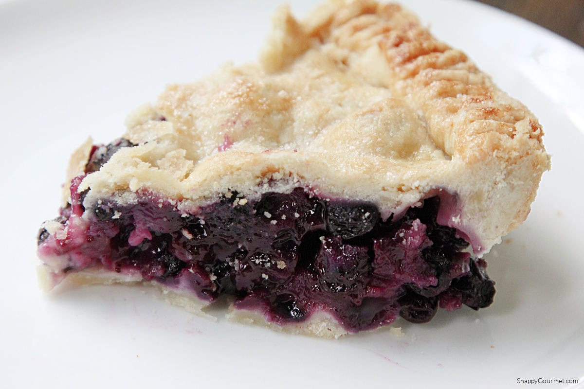 Blueberry Pie slice of fresh Blueberry Pie on plate
