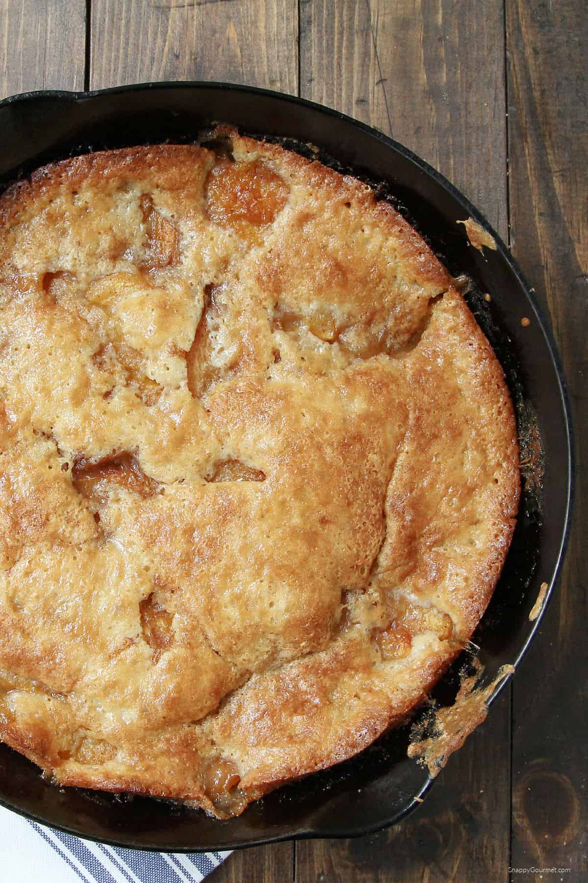Cast Iron Peach Cobbler on towel