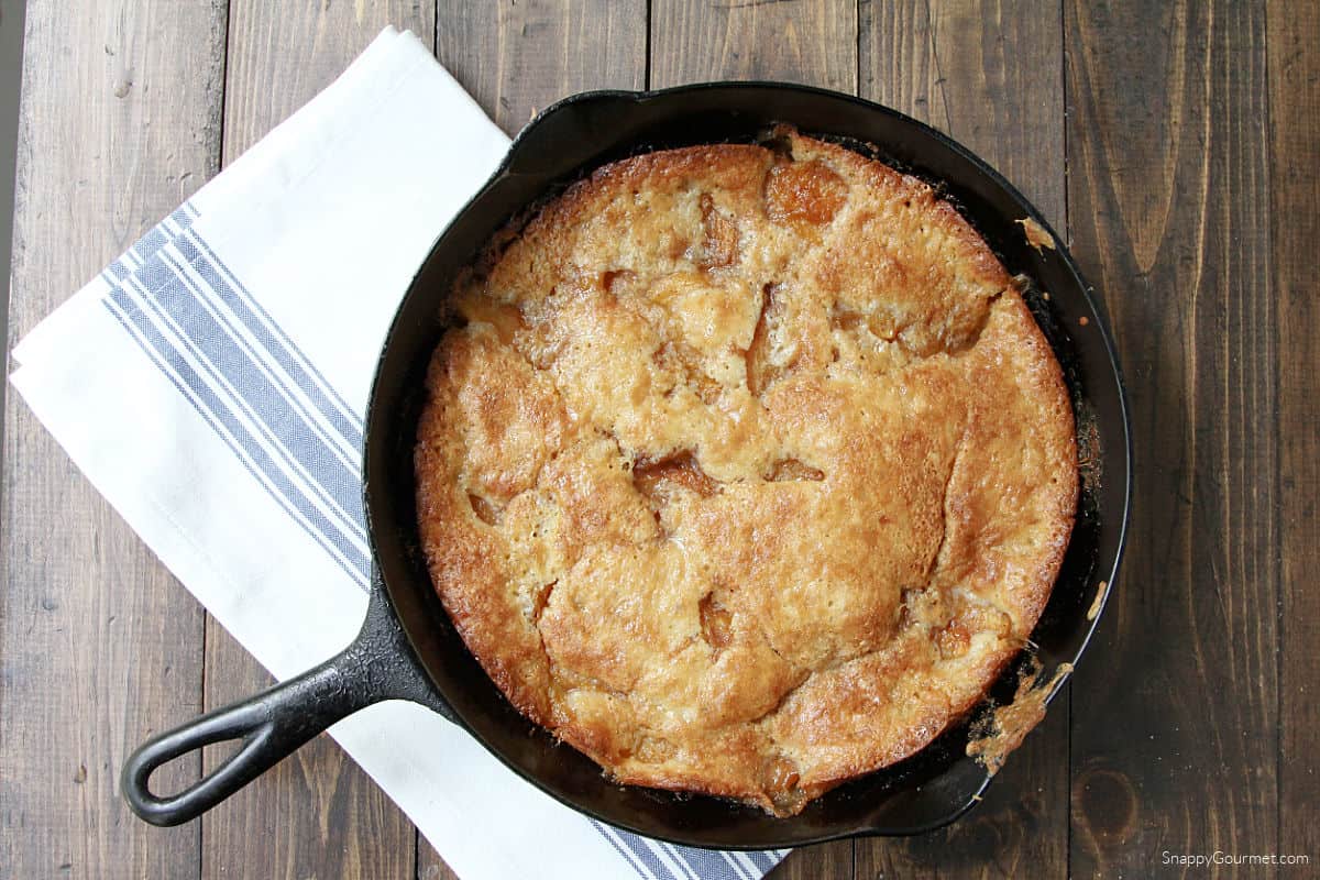 Cast Iron Peach Cobbler on towel