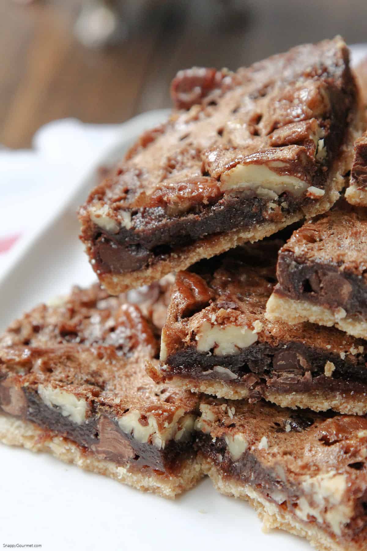 stack of Chocolate Pecan Pie Bars on plate