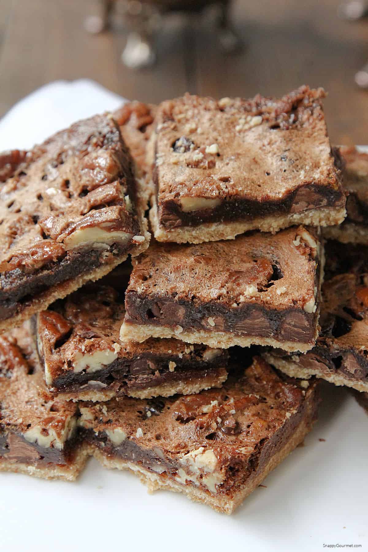 Chocolate Pecan Pie Bars stacked on plate