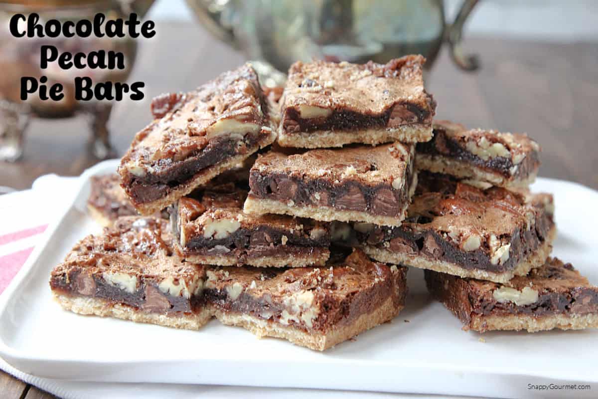 plate with stacked Chocolate Pecan Pie Bars