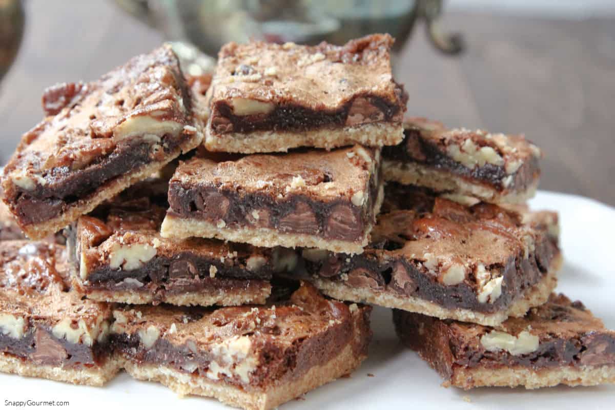 plate with stacked Chocolate Pecan Pie Bars