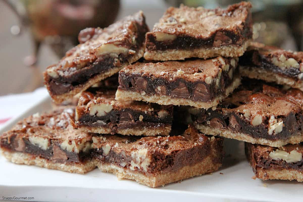 stacked of Chocolate Pecan Pie Bars on plate