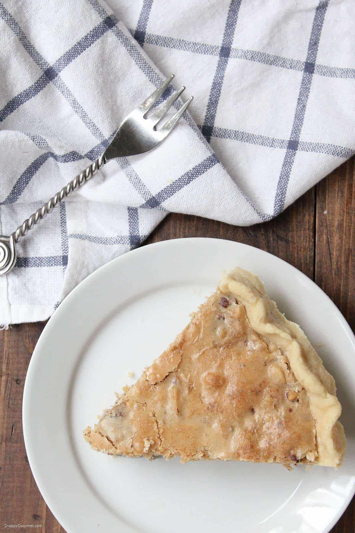 Chocolate Walnut Cookie Pie slice of Chocolate Walnut Cookie Pie on plate