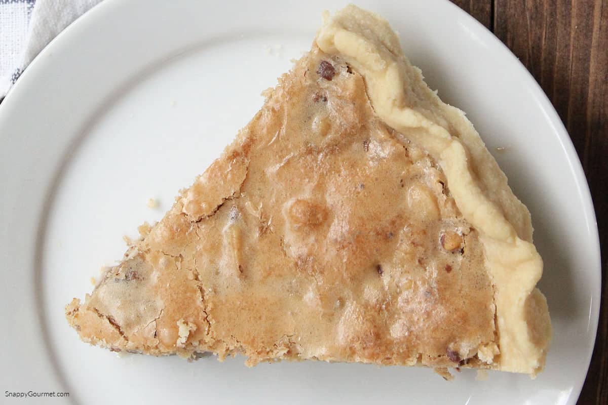 Chocolate Walnut Cookie Pie slice of Chocolate Walnut Cookie Pie on plate