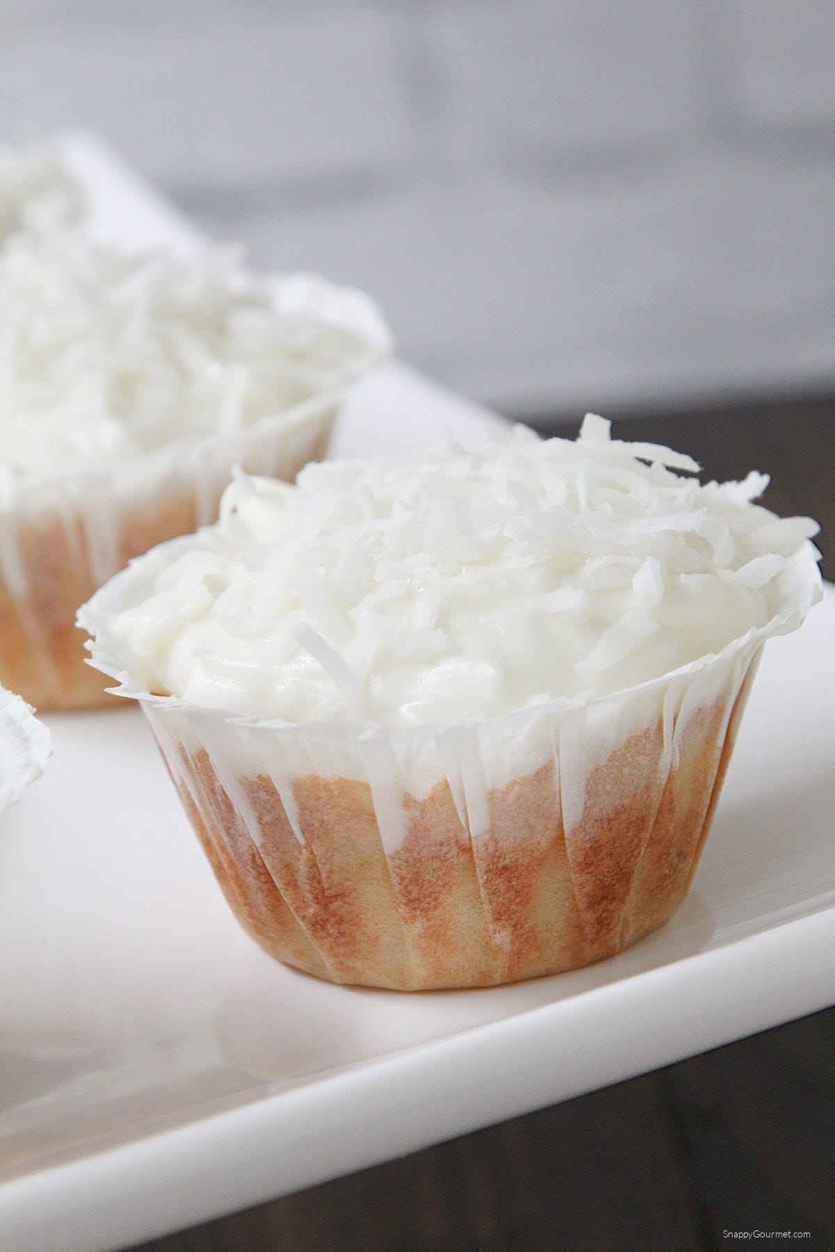 homemade Coconut Cupcakes on cake platter