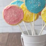 multiple homemade Cookie Pops standing in container