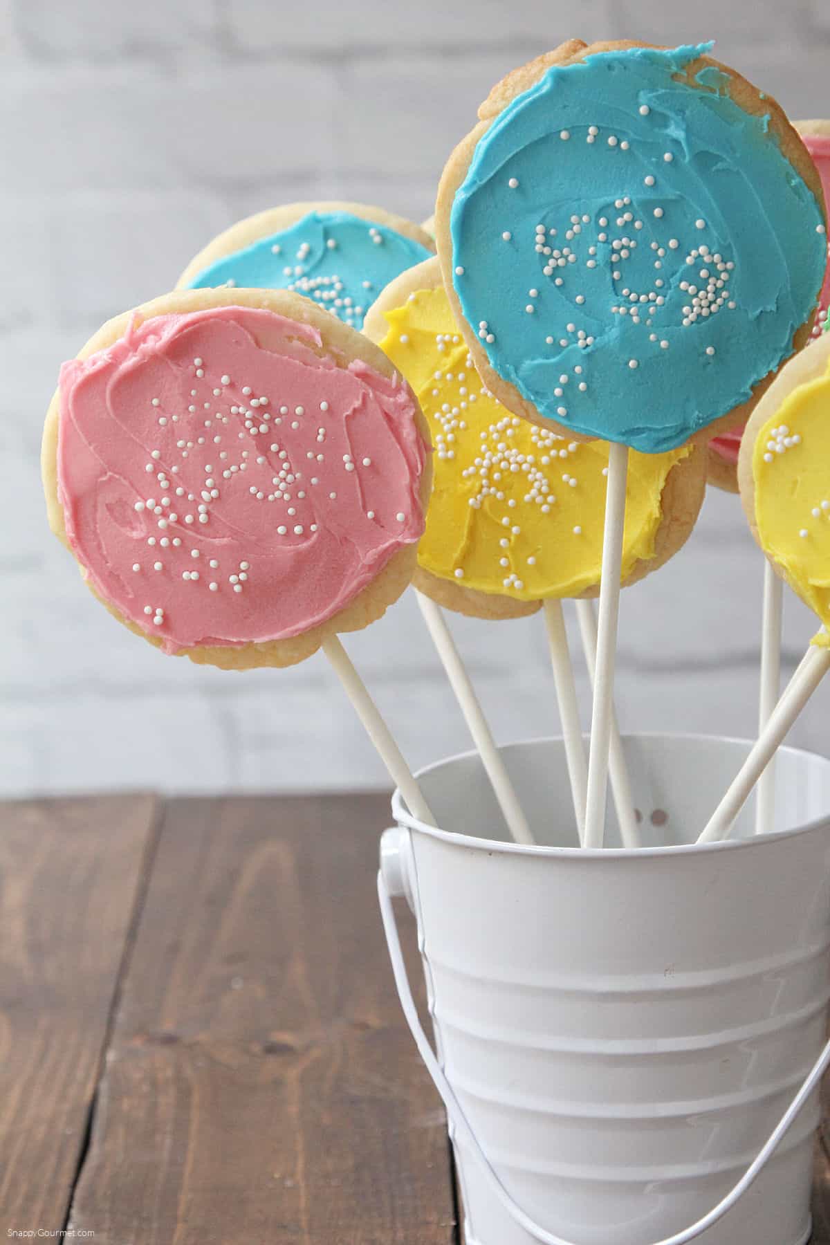 multiple homemade Cookie Pops standing in container