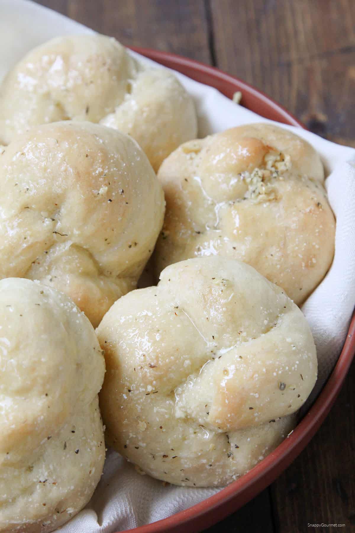 Garlic Knots homemade Garlic Knots on towel in shallow bowl