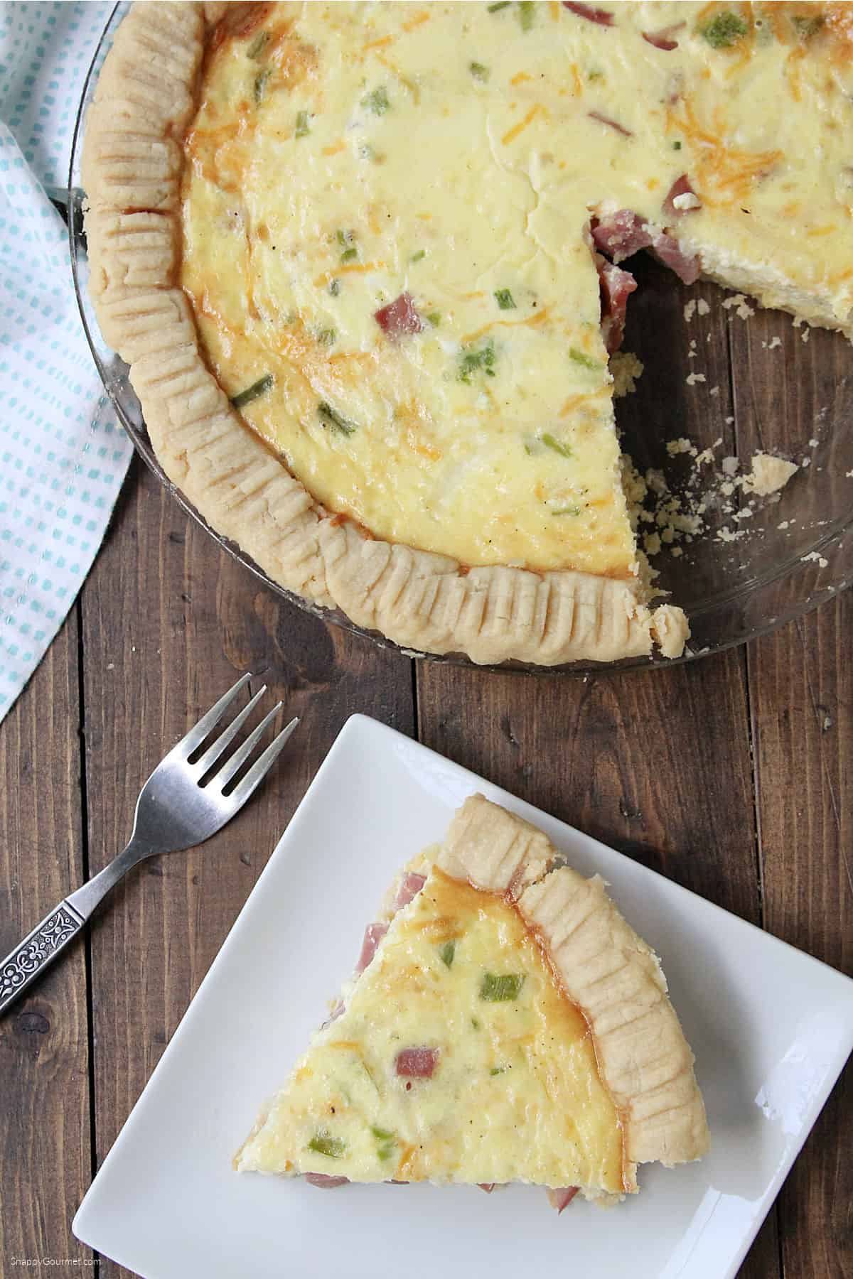 Ham and Cheese Quiche Ham and Cheese Quiche in pie plate and slice on plate