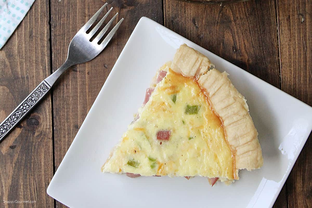 Ham and Cheese Quiche slice of Ham and Cheese Quiche on plate