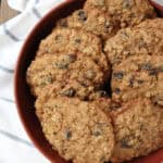 Oatmeal Raisin Cookies in shallow bowl on top of towel