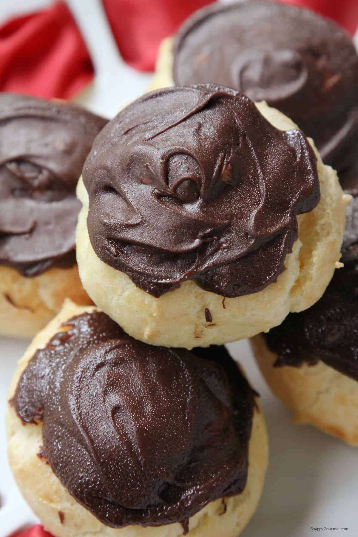 stack of chocolate dipped Profiteroles on plate