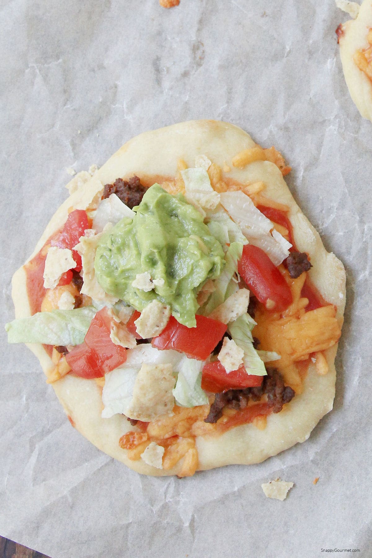 Taco Pizzas Taco Pizza on parchment paper