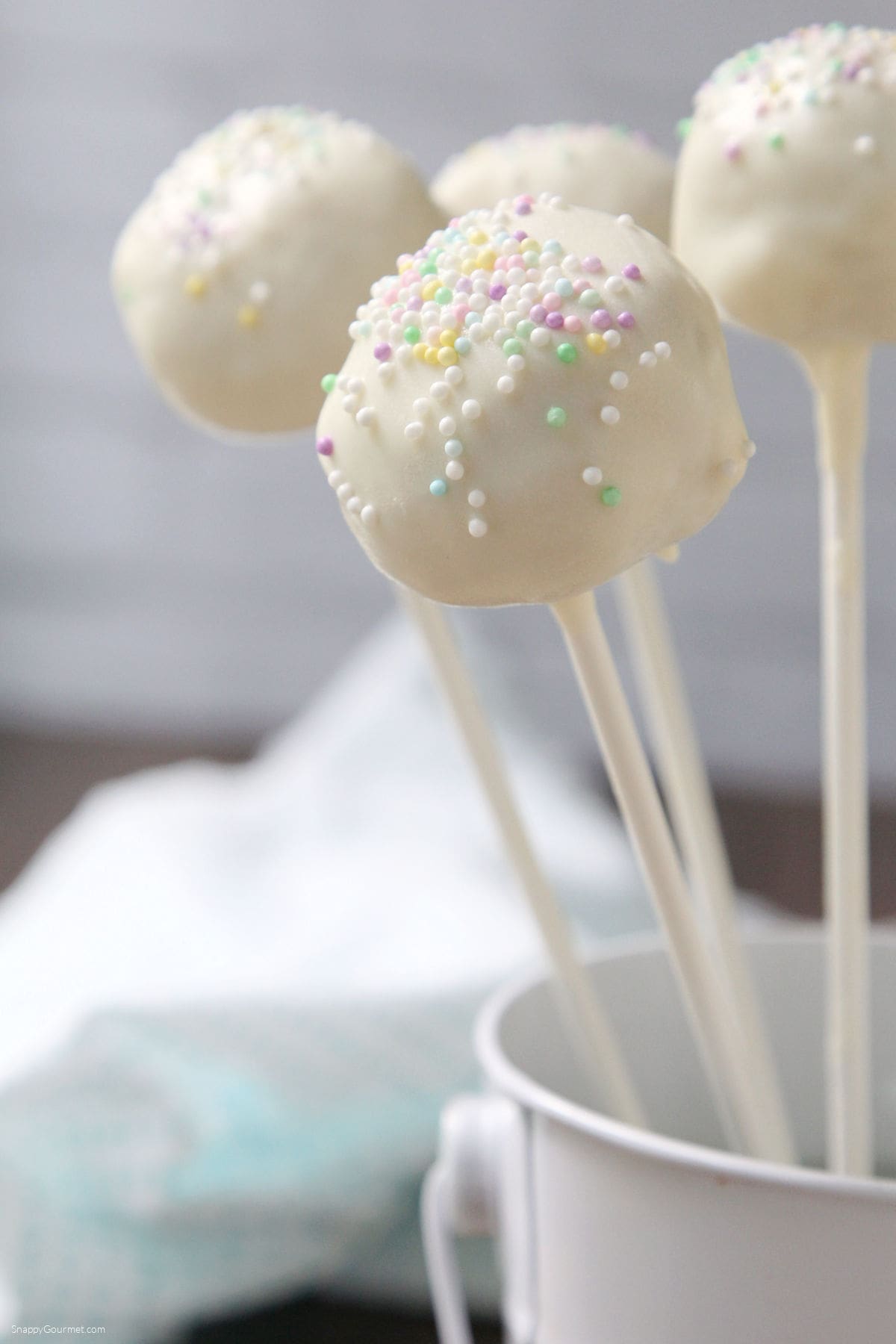 Vanilla Cake Pops closeup of Vanilla Cake Pop with sprinkles standing up in small bucket