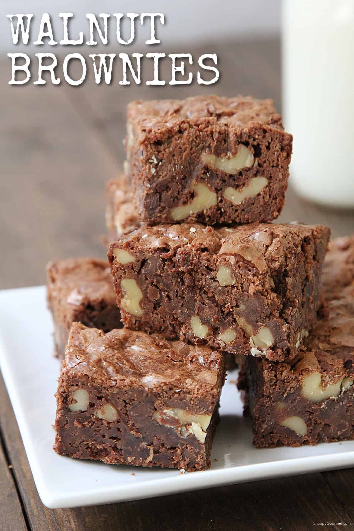Walnut Brownies stacked on plate