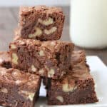 Walnut Brownies stacked on plate