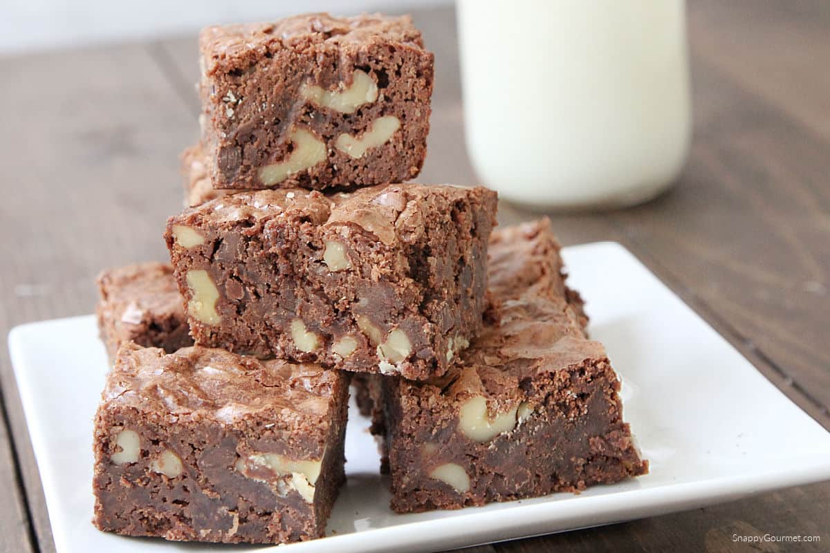 plate topped with stacked Walnut Brownies