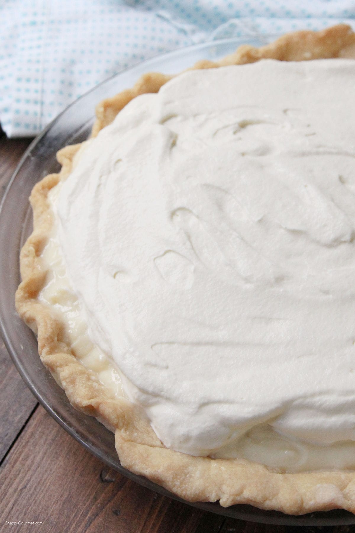 Banana Cream Pie Banana Cream Pie in glass pie plate and topped with whipped cream