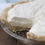 Banana Cream Pie in pie plate topped with whipped cream