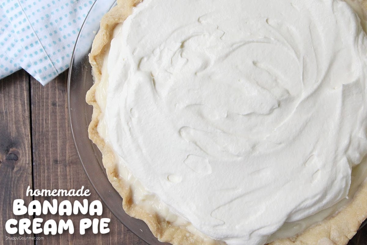 Banana Cream Pie Banana Cream Pie topped with whipped cream in pie plate