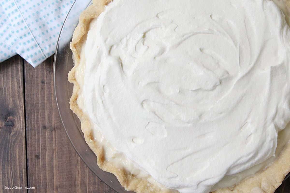 Banana Cream Pie Banana Cream Pie in glass pie plate topped with whipped cream
